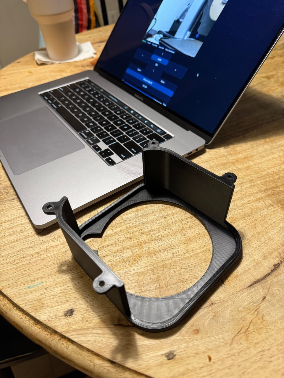 Mac Mini mount raw phone photo on wood table