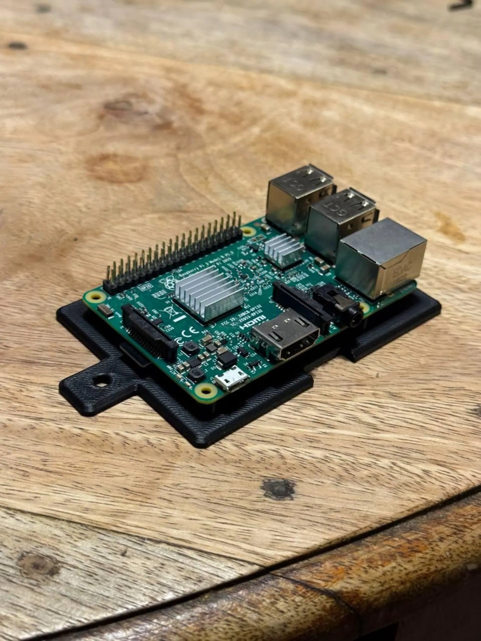Pi mount raw phone photo on wood table